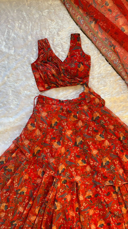 Red floral dress on a textured white surface